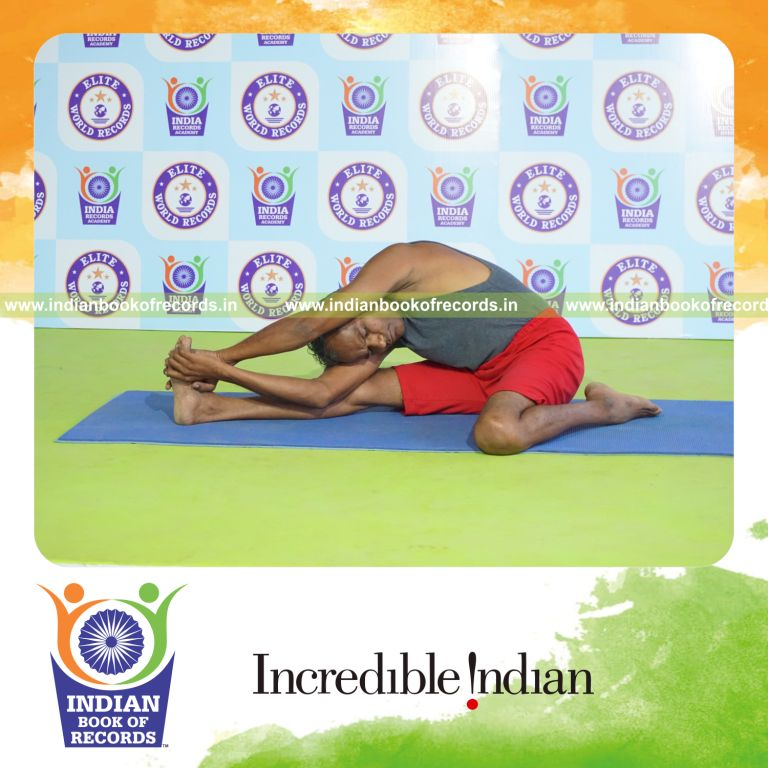 individual holding daksina parivrtta gomukha janu sirsasana yoga pose for record in Indian Book of Records