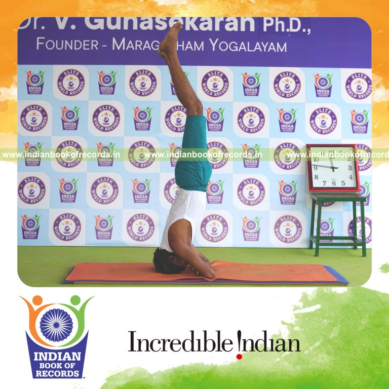 an individual holding daksina parsva baddha hastha sirsasana yoga pose blindfolded continuously for the longest duration with balance and control for a record in Indian Book of Records
