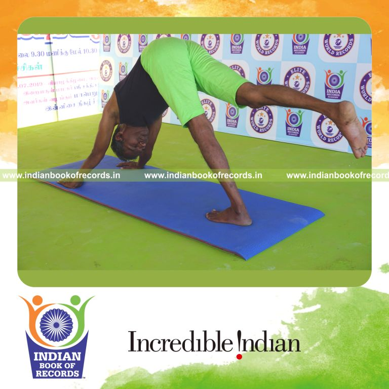 an individual holding daksina parsva ekapada adho mukha svanasana yoga pose continuously for the longest duration with balance and strength for a record in Indian Book of Records