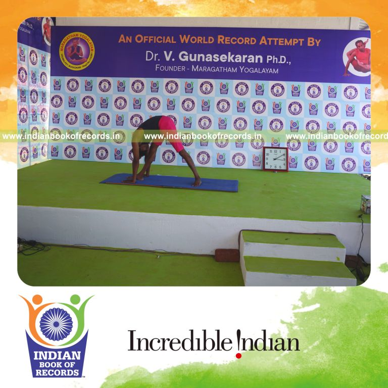 an individual holding daksina parsvottanasana yoga pose blindfolded for the longest duration with flexibility and balance for a record in Indian Book of Records