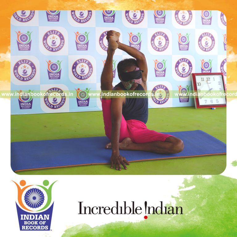 an individual holding daksina purna krounchasana yoga pose blindfolded for the longest duration with flexibility and control for a record in Indian Book of Records