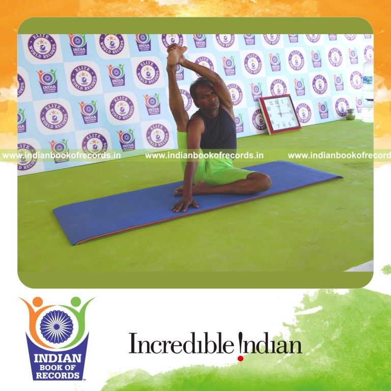 an individual holding daksina purna krounchasana yoga pose continuously for the longest duration with flexibility and endurance for a record in Indian Book of Records