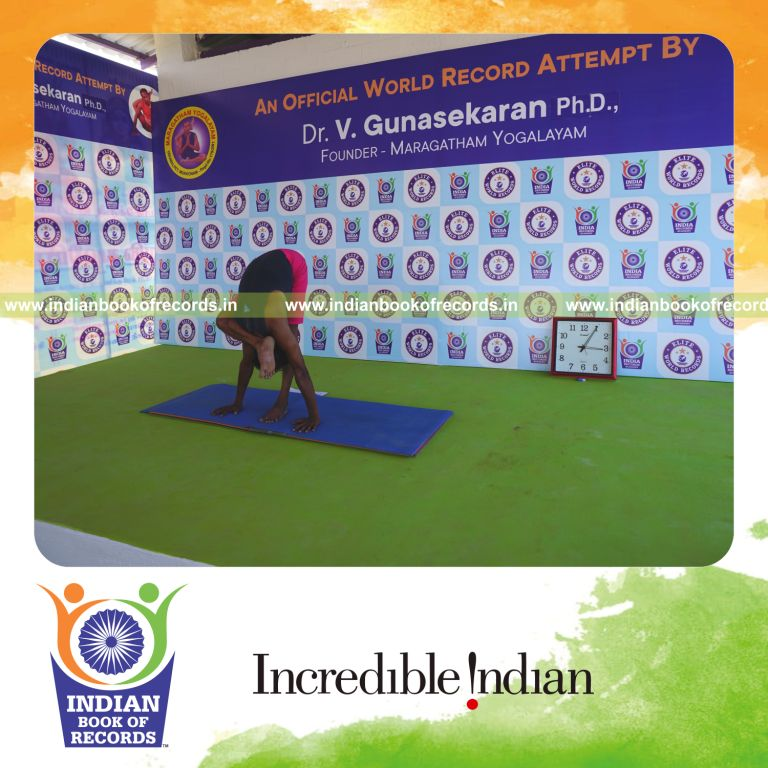 an individual holding daksina ruchikasana yoga pose blindfolded for the longest duration with flexibility and control for a record in Indian Book of Records