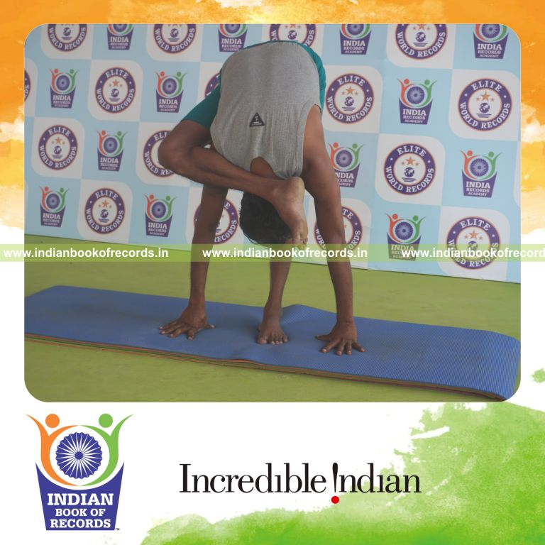 individual holding daksina ruchikasana yoga pose for record in Indian Book of Records