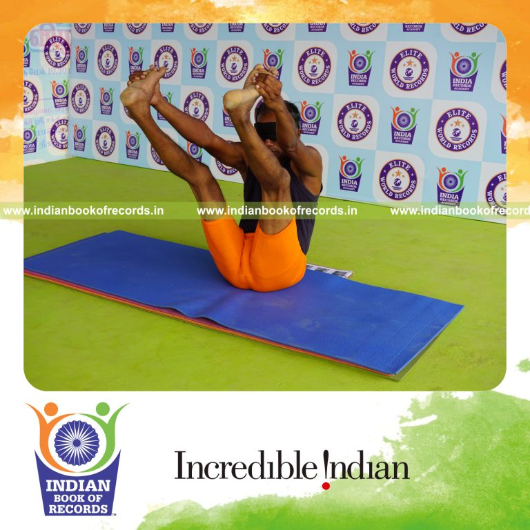 individual holding enkonasana yoga pose blindfolded for record in Indian Book of Records