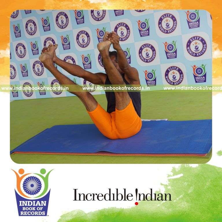 individual holding enkonasana yoga pose for record in Indian Book of Records