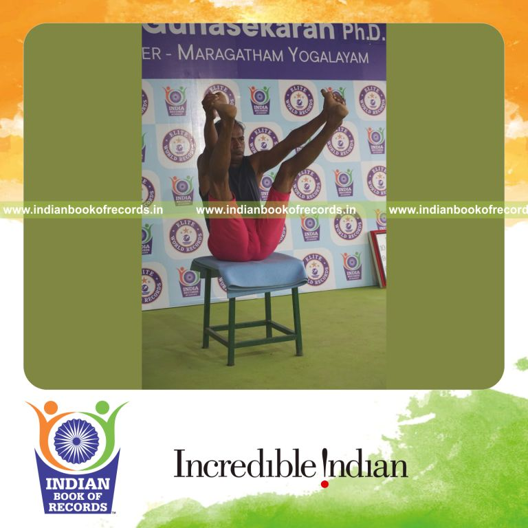 individual holding enkonasana yoga pose on a stool for record in Indian Book of Records