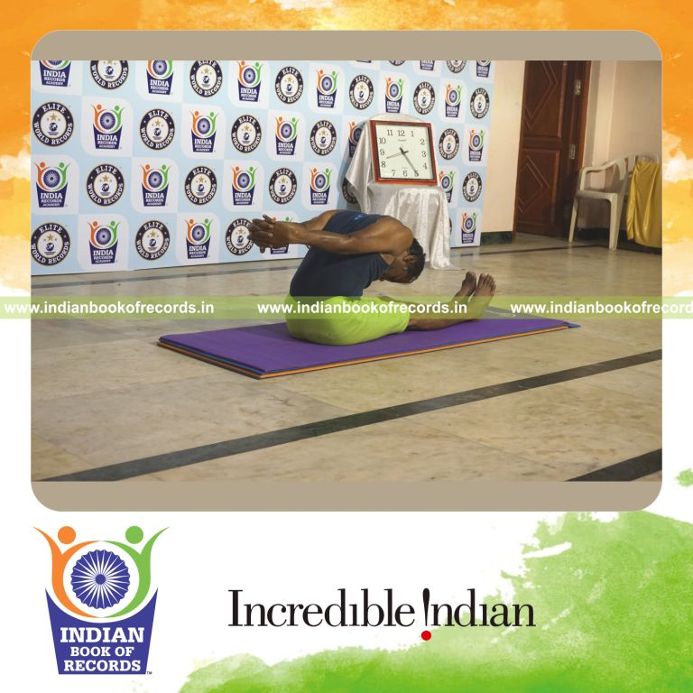 individual holding gopura paschimottanasana yoga pose for record in Indian Book of Records