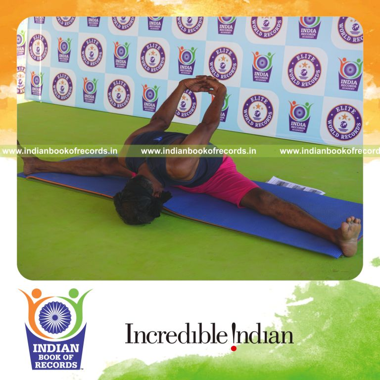 an individual holding gopura upavistha konasana yoga pose blindfolded for the longest duration with flexibility and control for a record in Indian Book of Records