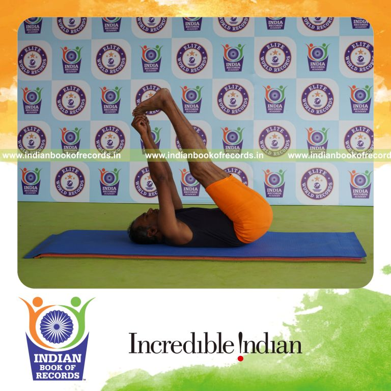 individual holding julasana yoga pose for record in Indian Book of Records