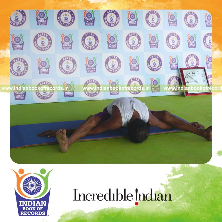 individual holding kurmasana yoga pose blindfolded for record in Indian Book of Records