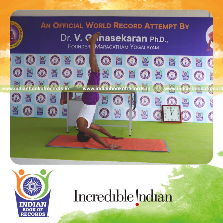 individual holding mukta sirsasana yoga pose blindfolded for record in Indian Book of Records