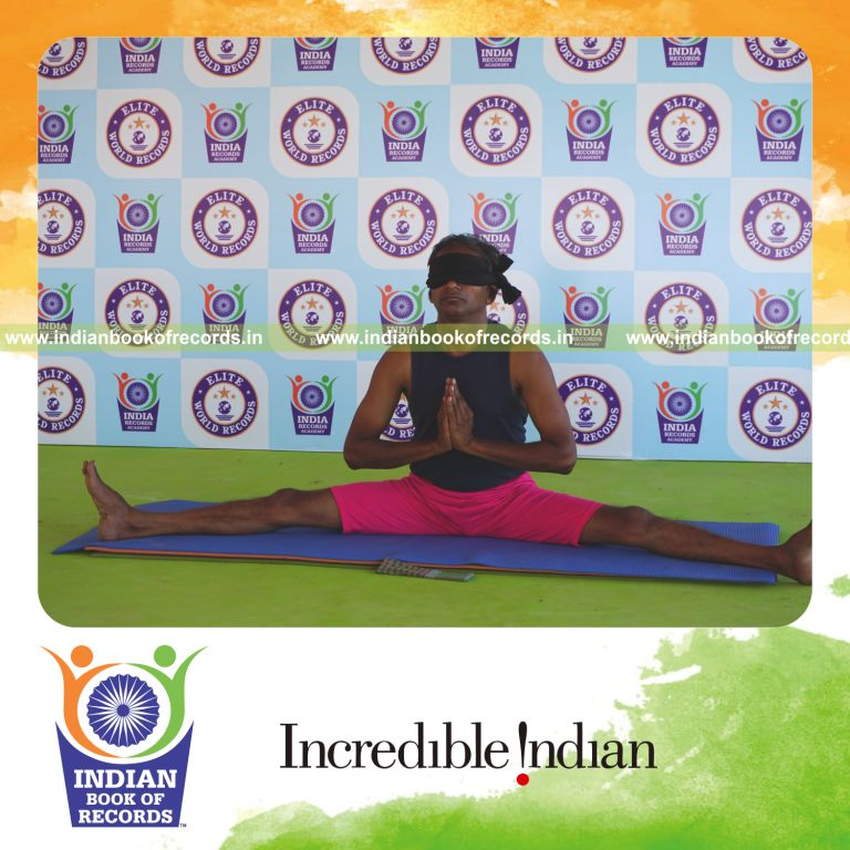 an individual holding namaskar upavistha konasana yoga pose blindfolded for the longest duration with control and flexibility for a record in Indian Book of Records