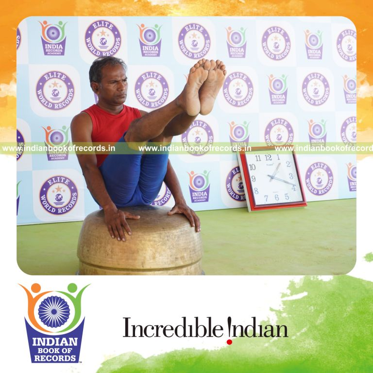 individual holding navasana yoga pose on a vessel for record in Indian Book of Records