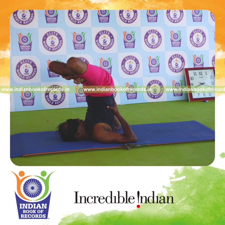 an individual holding padma sarvangasana yoga pose blindfolded for the longest duration with balance and control for a record in Indian Book of Records