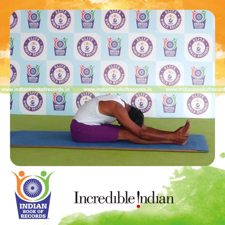 individual holding paschimottanasana yoga pose blindfolded for record in Indian Book of Records