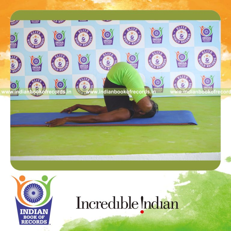an individual holding pindasana in salamba sarvangasana yoga pose continuously for the longest duration with control and balance for a record in Indian Book of Records