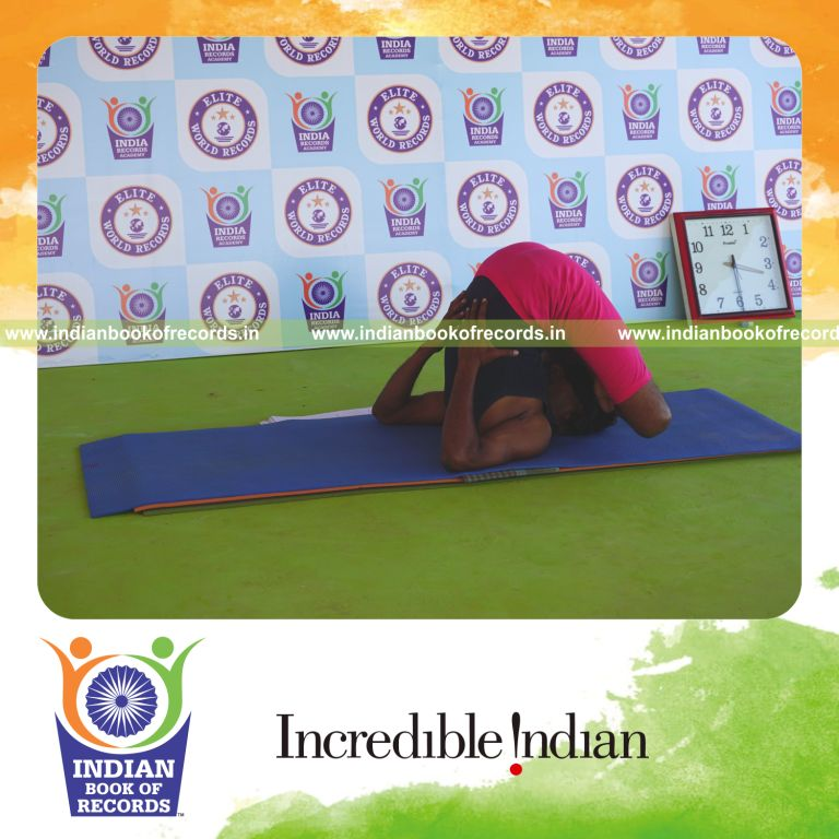 an individual holding pindasana in sarvangasana yoga pose blindfolded for the longest duration with balance and control for a record in Indian Book of Records