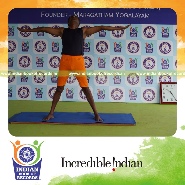 individual holding pirai chaturmukha trikonasana yoga pose for record in Indian Book of Records