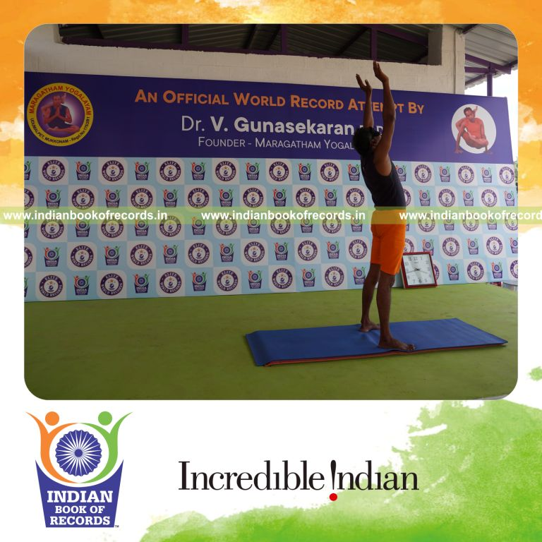 individual holding piraiasana yoga pose blindfolded for record in Indian Book of Records