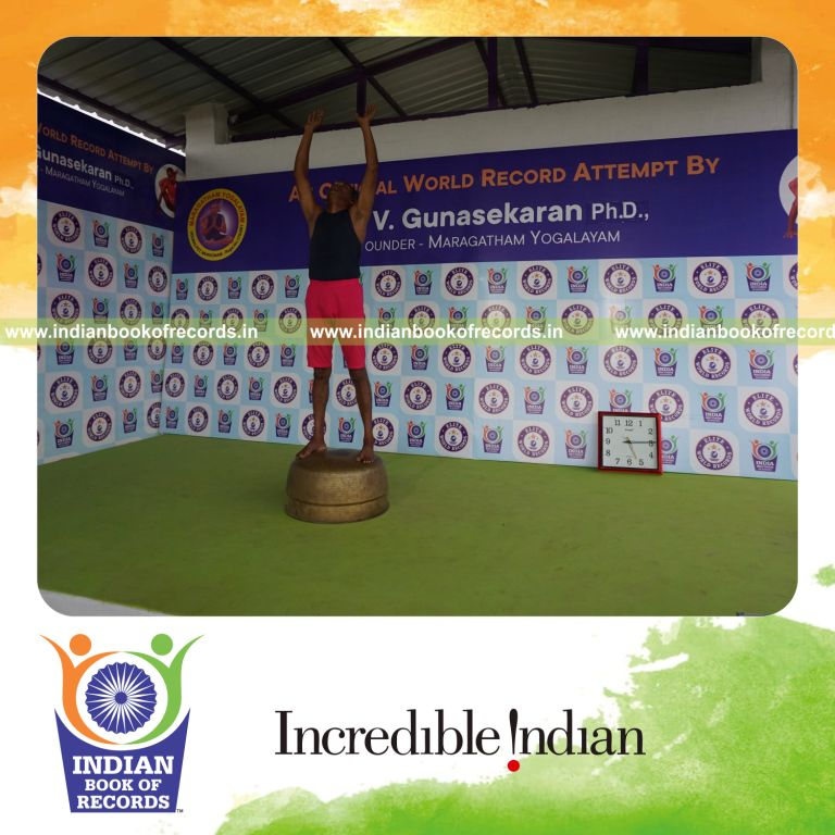 individual holding piraiasana yoga pose on a vessel for record in Indian Book of Records