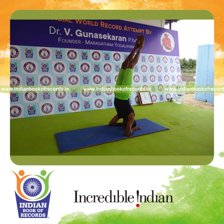 an individual holding salamba sirsasana yoga pose blindfolded continuously for the longest duration with balance and control for a record in Indian Book of Records