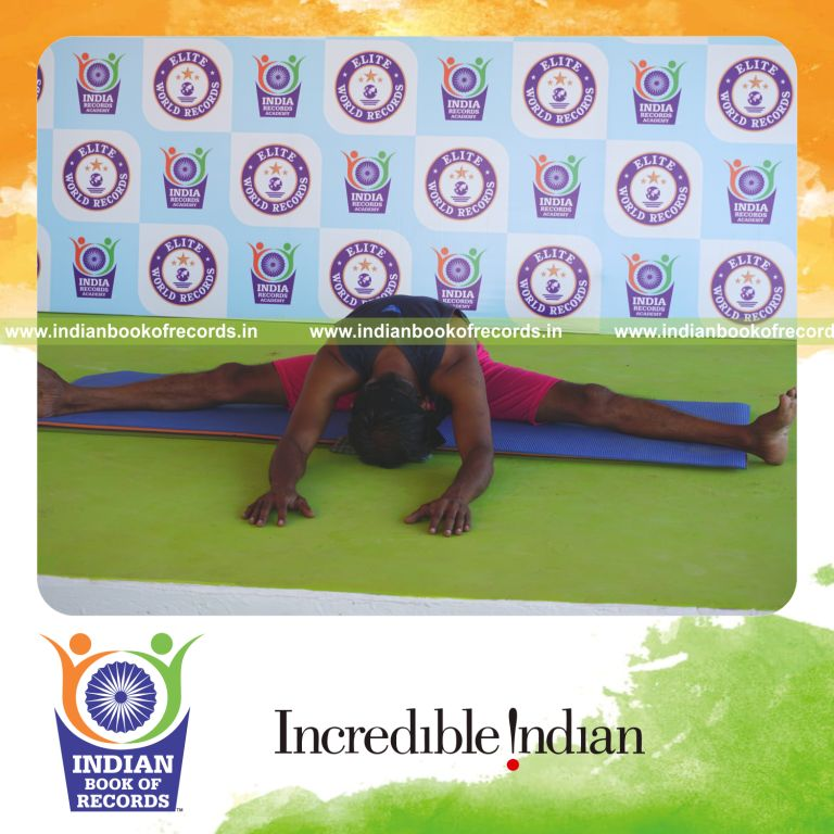 an individual holding sasanga upavistha konasana yoga pose blindfolded for the longest duration with flexibility and balance for a record in Indian Book of Records
