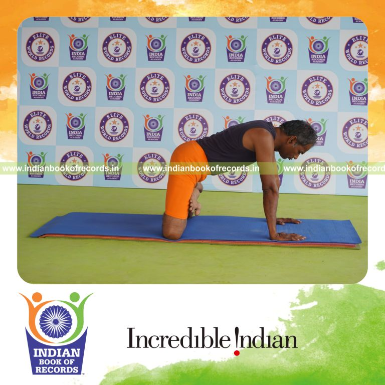 individual holding simhasana yoga pose for record in Indian Book of Records