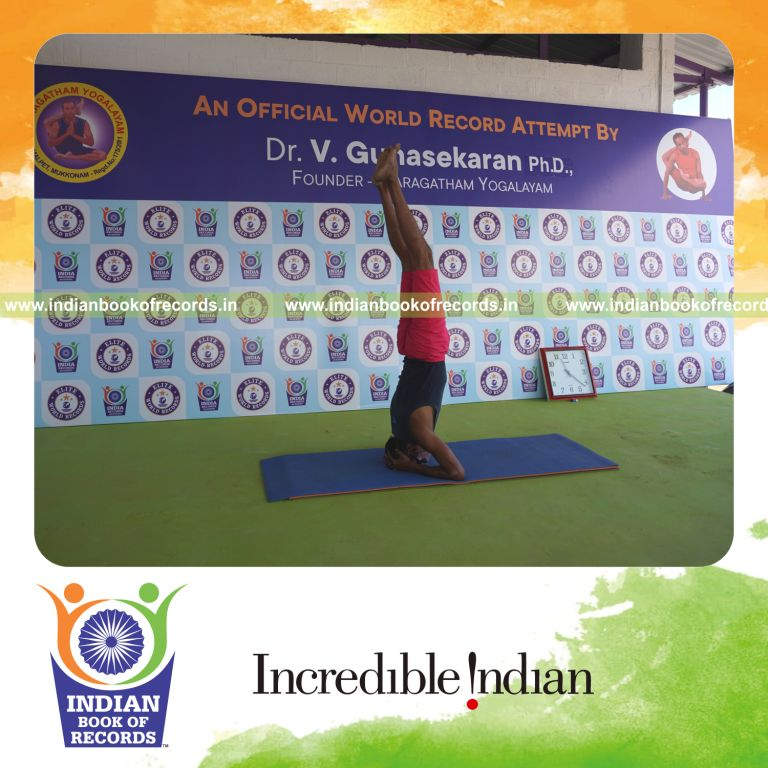 an individual holding sirasasana yoga pose blindfolded for the longest duration with balance and control for a record in Indian Book of Records