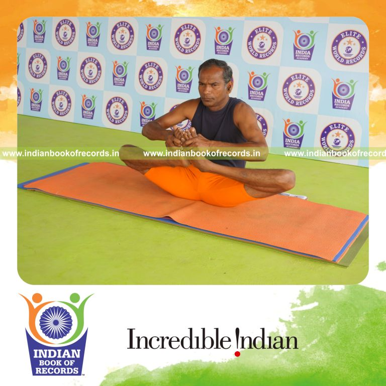 individual holding skandasana yoga pose for record in Indian Book of Records