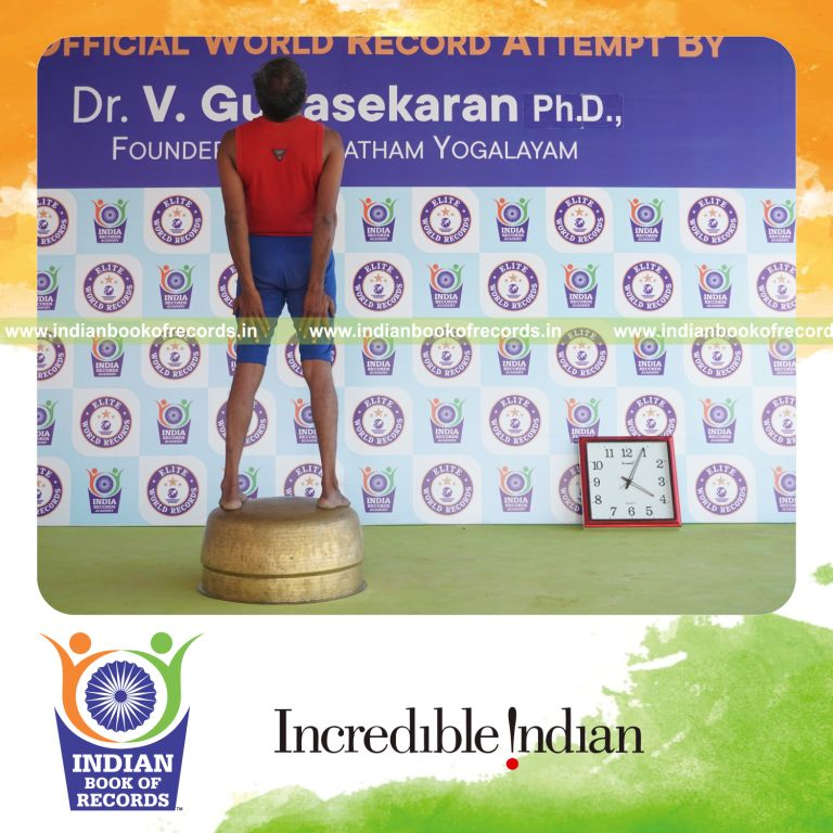 individual holding trianga mukthasana yoga pose on a vessel for record in Indian Book of Records