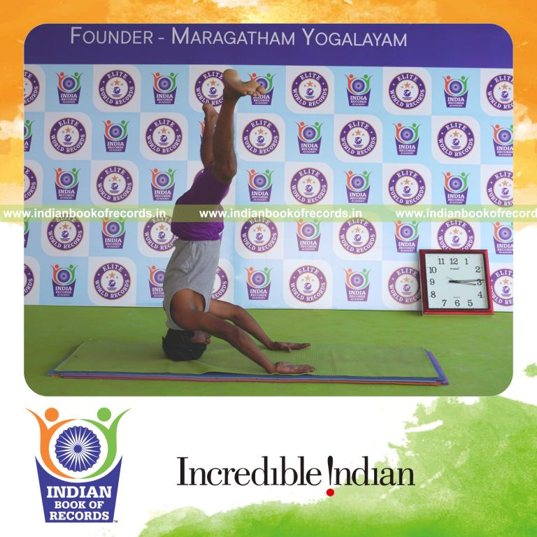 individual holding upavistha mukta sirsasana yoga pose blindfolded for record in Indian Book of Records