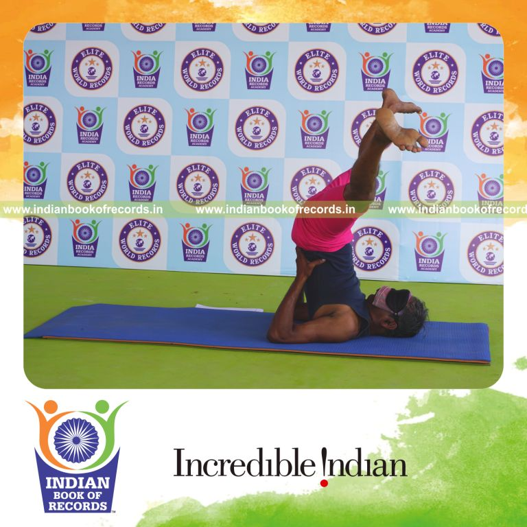 an individual holding upavistha sarvangasana yoga pose blindfolded for the longest duration with balance and control for a record in Indian Book of Records