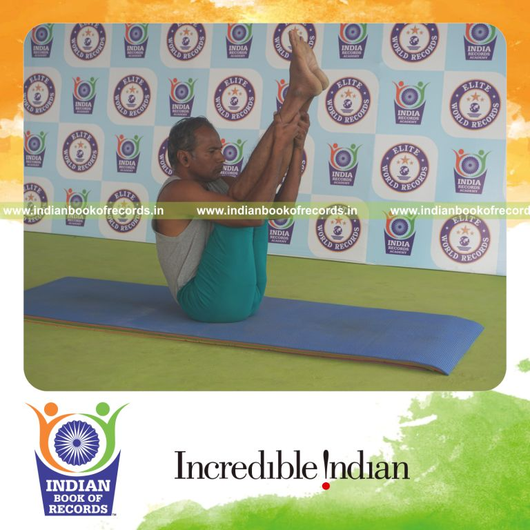 individual holding urdhva mukha paschimottanasana yoga pose for record in Indian Book of Records
