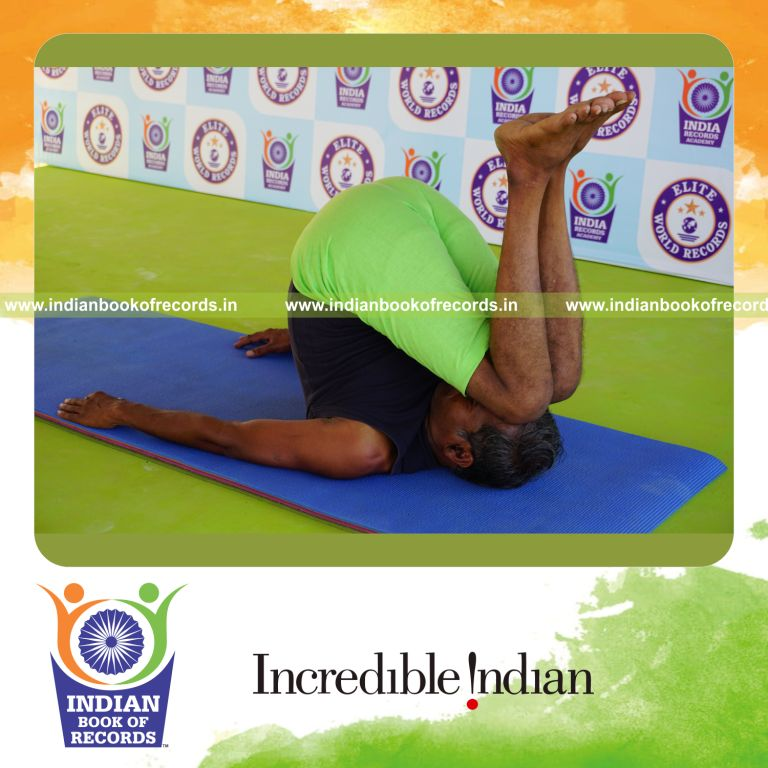 an individual holding urdhva salamba sarvangasana yoga pose continuously for the longest duration with strength and control for a record in Indian Book of Records