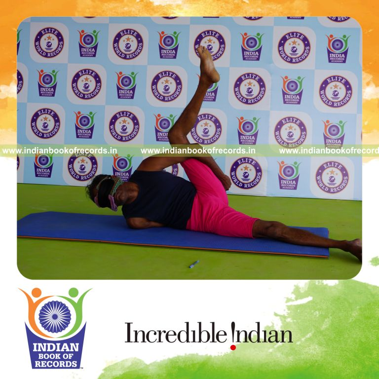 an individual holding vama aananda ardha matsyendrasana yoga pose blindfolded for the longest duration with flexibility and control for a record in Indian Book of Records