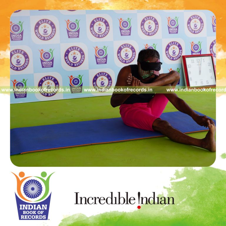an individual holding vama akarna dhanurasana yoga pose blindfolded for the longest duration with flexibility and control for a record in Indian Book of Records