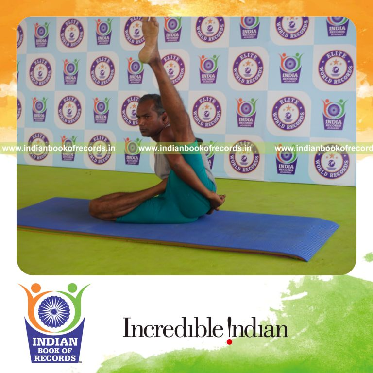 individual holding vama ardha baddha parsva krounchasana yoga pose for record in Indian Book of Records