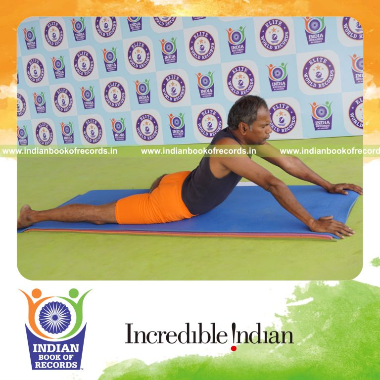 individual holding vama ardha bhujangasana yoga pose for record in Indian Book of Records