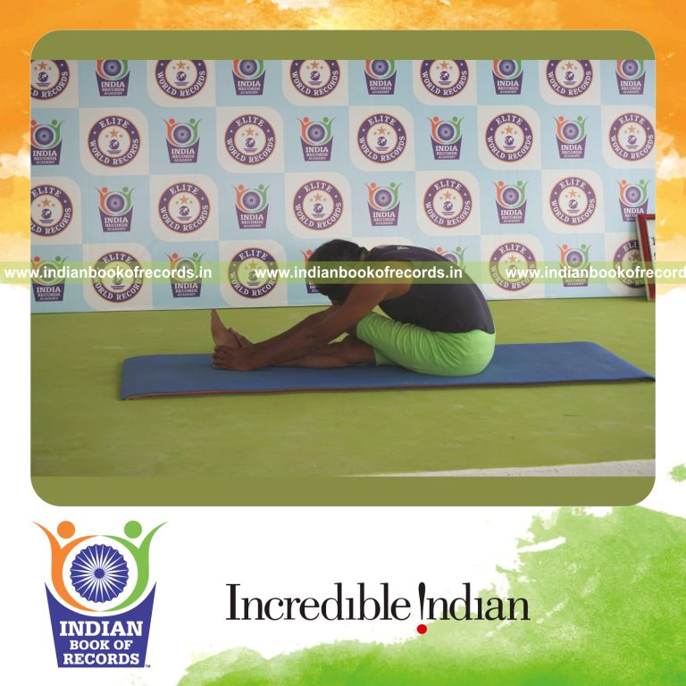 an individual holding vama ardha janu sirsasana yoga pose blindfolded for the longest duration with flexibility and balance for a record in Indian Book of Records