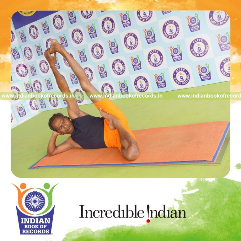 individual holding vama ardha padma anantasana yoga pose for record in Indian Book of Records