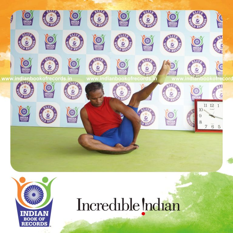 individual holding vama ardha parsva krounchasana yoga pose on a brass plate for record in Indian Book of Records