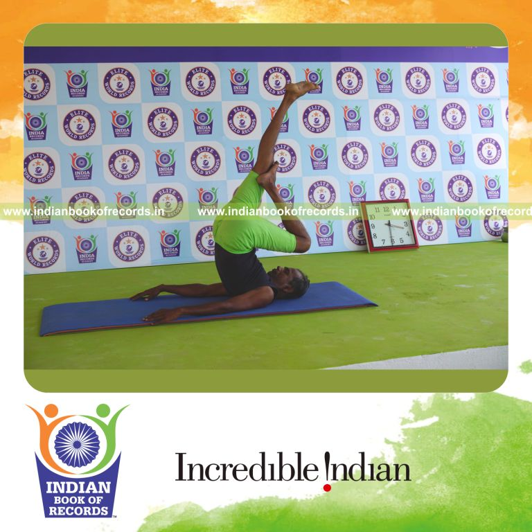 an individual holding vama ardha salamba sarvangasana yoga pose continuously for the longest duration with stability and balance for a record in Indian Book of Records