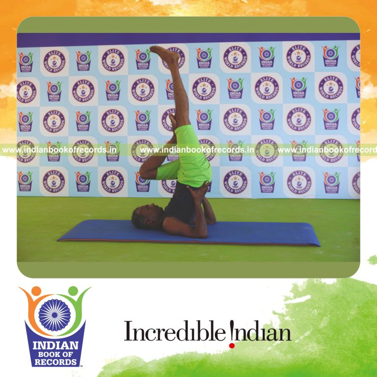 an individual holding vama ardha sarvangasana yoga pose continuously for the longest duration with balance and stability for a record in Indian Book of Records
