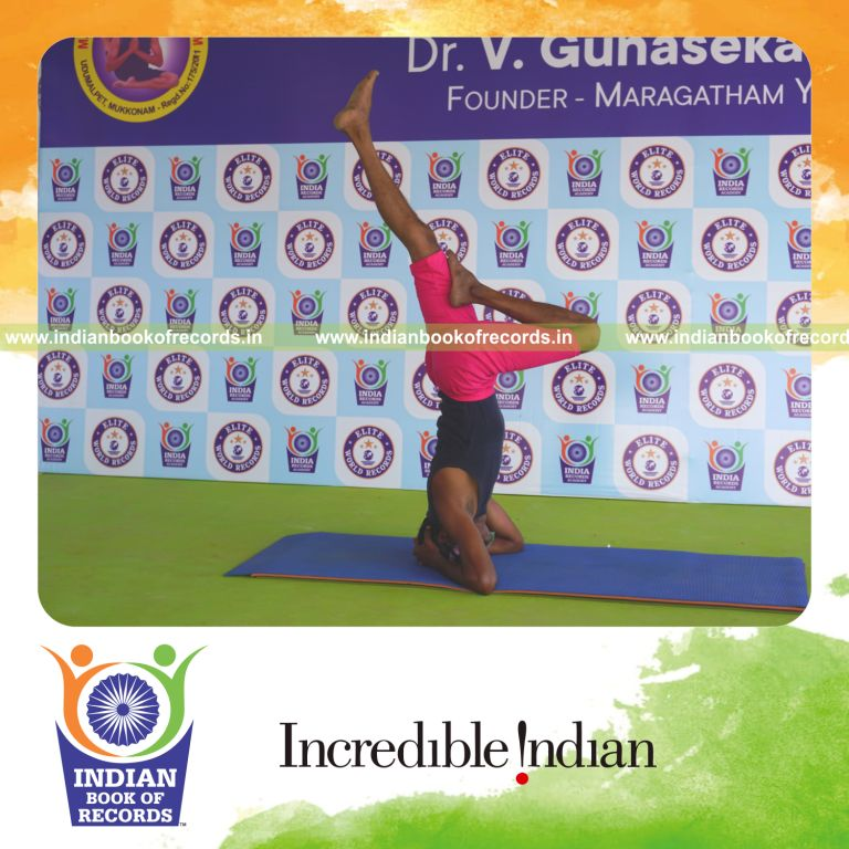 an individual holding vama ardha sirsasana yoga pose blindfolded for the longest duration with control and balance for a record in Indian Book of Records
