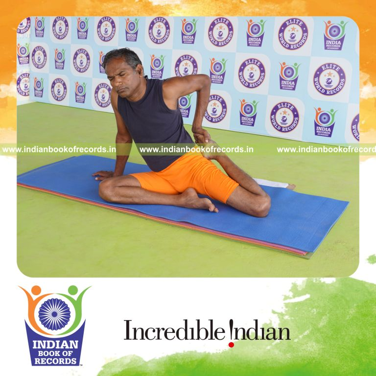 individual holding vama ardha vamadevasana yoga pose for record in Indian Book of Records