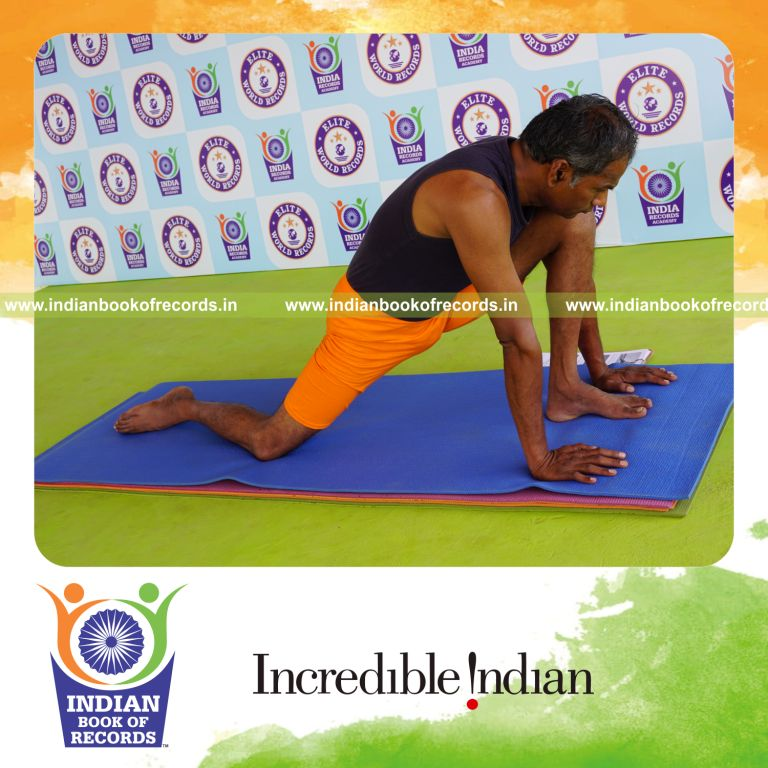 individual holding vama asva chanjalanasana yoga pose for record in Indian Book of Records