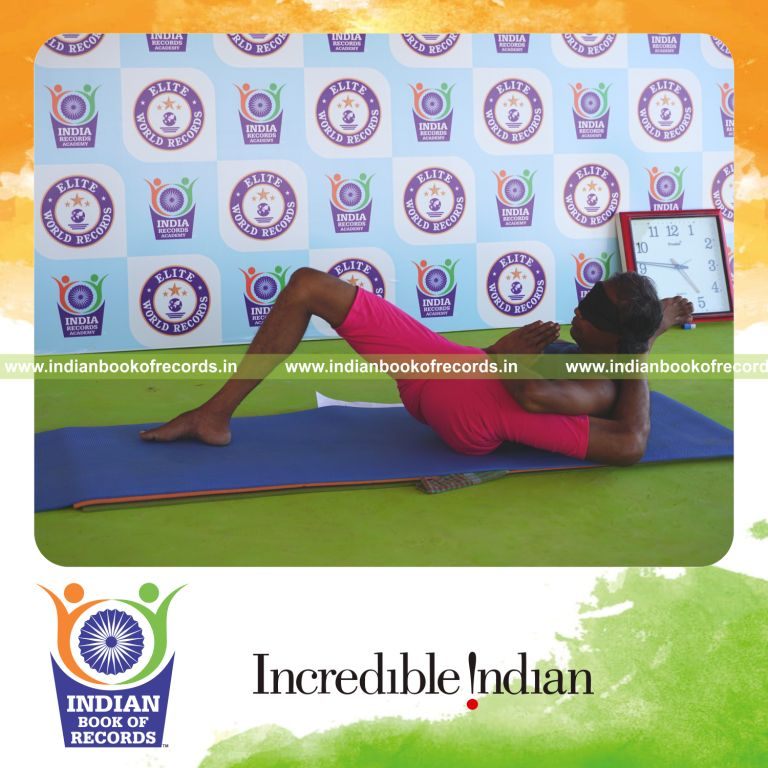 an individual holding vama bhairavasana yoga pose blindfolded for the longest duration with flexibility and control for a record in Indian Book of Records