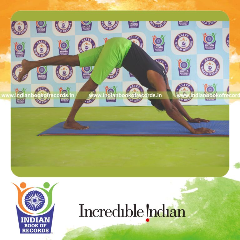 an individual holding vama ekapada adho mukha svanasana yoga pose blindfolded for the longest duration with balance and control for a record in Indian Book of Records