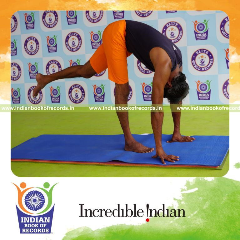 individual holding vama ekapada padahastasana yoga pose blindfolded for record in Indian Book of Records